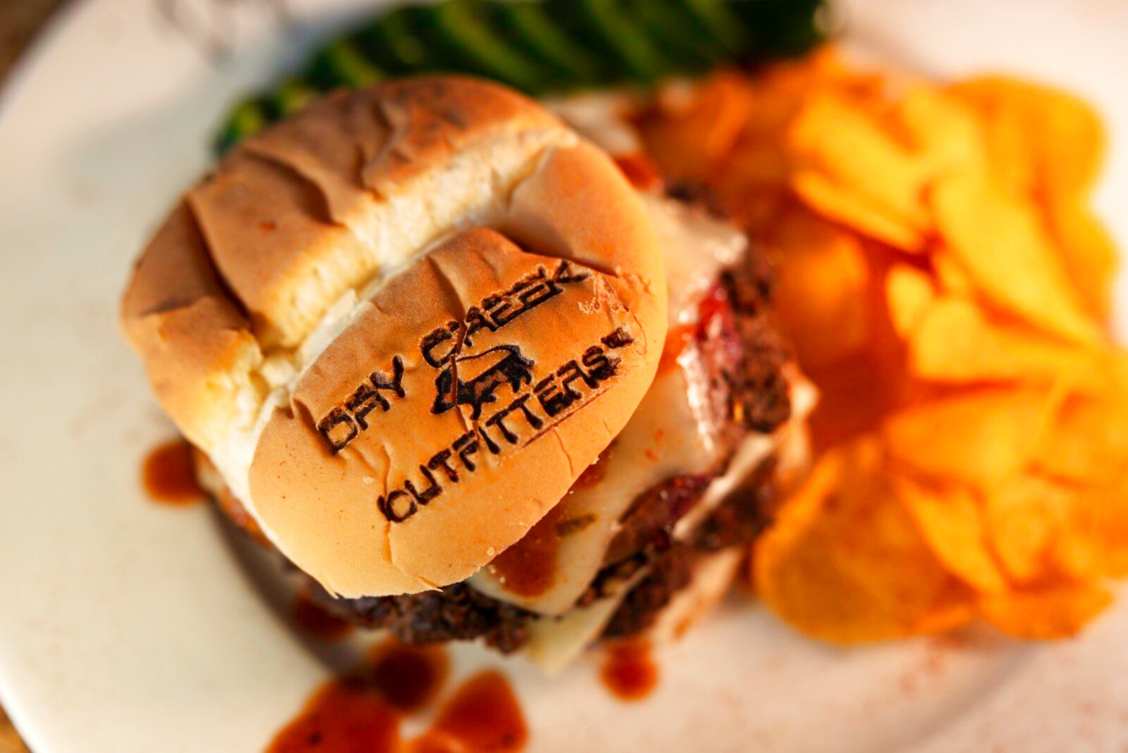 A Dry Creek Outfitters branded burger with chips