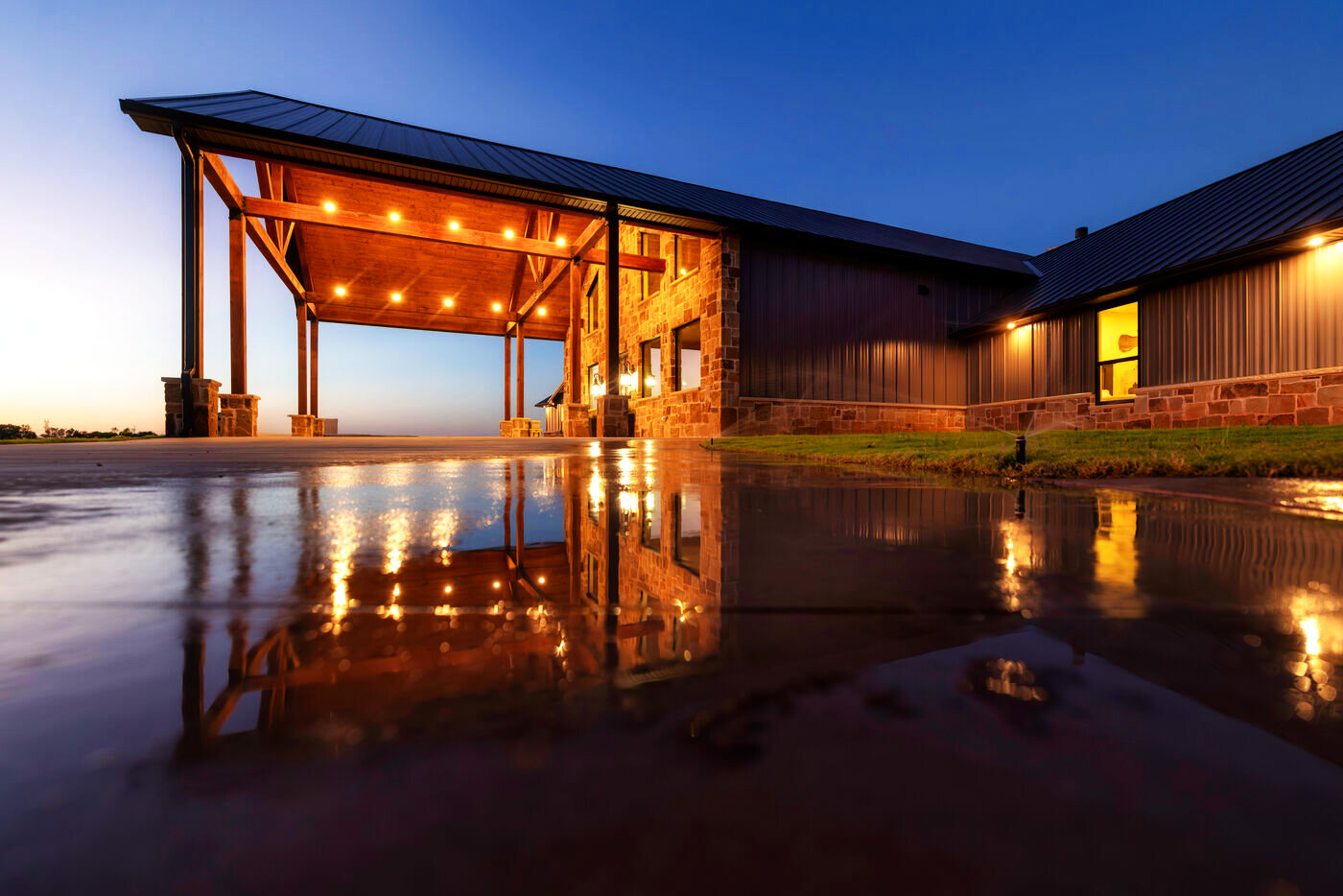The lodge reflected in water at dusk