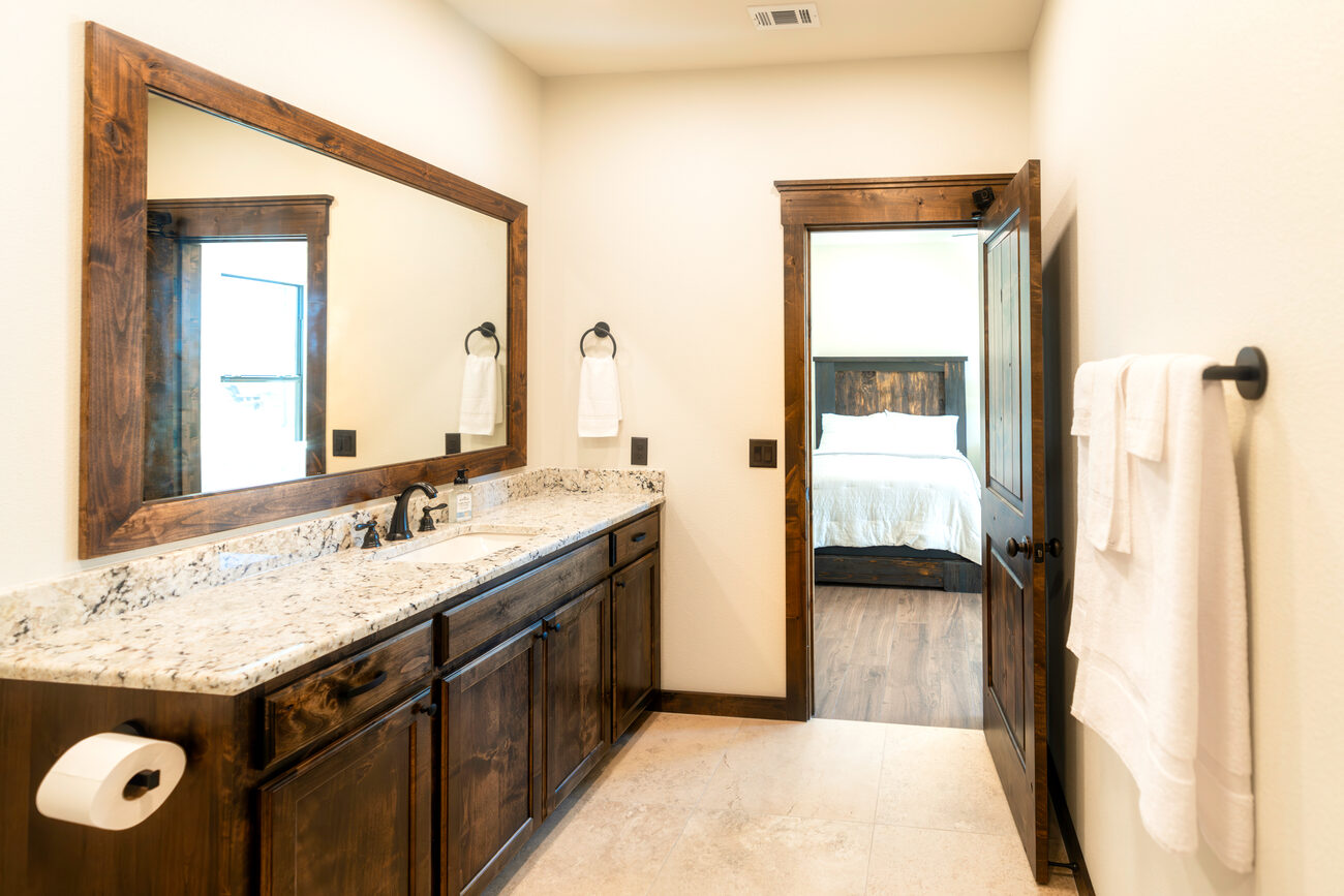 A bathroom with a granite vanity